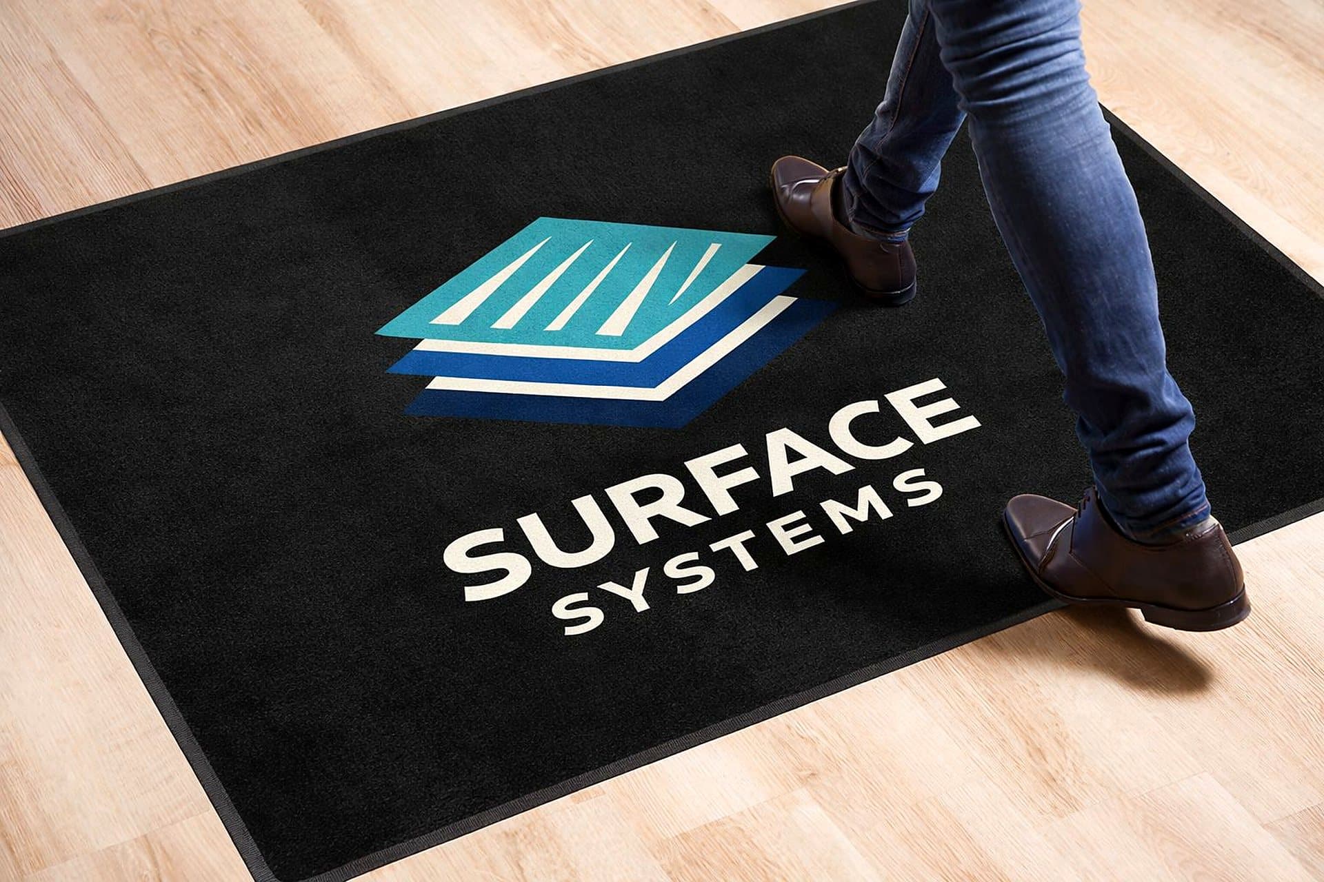 Pulse Fitness reception with custom-branded entrance floor mat
